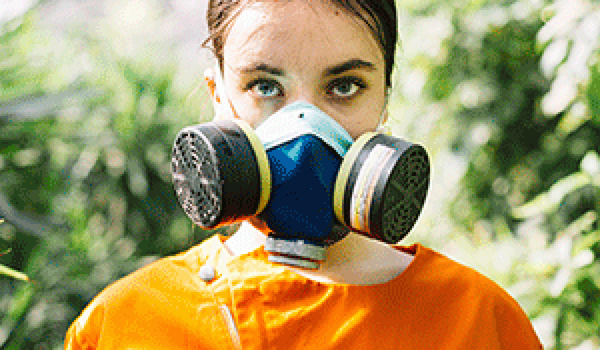 portrait-female-gardener-wearing-pollution-mask